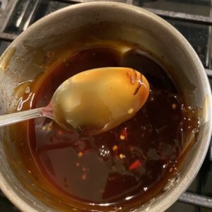 Maple soy sauce coating back of a spoon