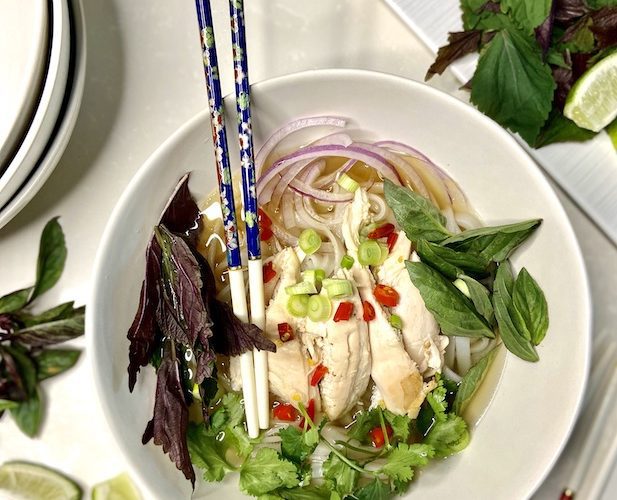 Pho gà ready to serve with toppings
