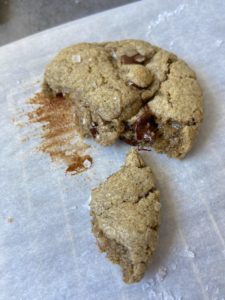 Cookie split in two on parchment paper