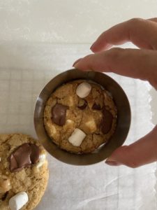 Shaping the chocolate ship s'mores cookie with a rind mold