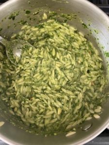 Combined orzo pasta with pesto in pot