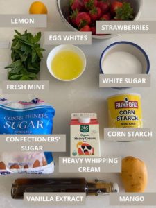 Ingredients needed to make fresh mint strawberry mango mini pavlovas: fresh mint, egg whites, strawberries, confectioners' sugar, heavy whippping cream, white sugar, cornstarch, mango and vanilla extract
