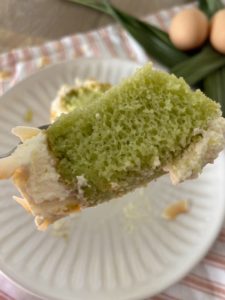 Close up of the Pandan Chiffon cake with whipped cream frosting. This picture shows how fluffly the cake is.