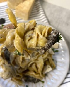 Fork with creamy truffle and morels pasta 