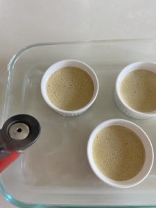 Pourring hot water in baking dish