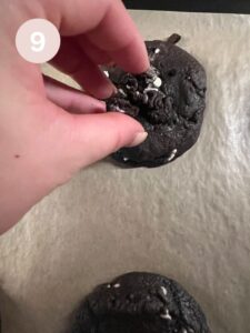Adding crushed oreos on top of baked cookies