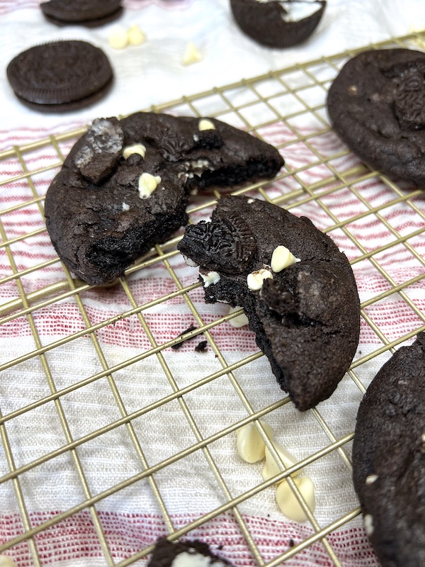 A split dark chocolate oreo cookies and cream cookie