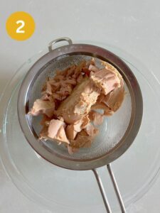 Draining tuna with a strainer
