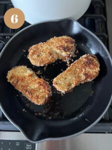 Frying second side of French toast on a skillet