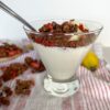 Bowl of yoghurt garnished with Dark Chocolate Strawberry Granola