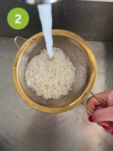Draining sweet rice with a sieve